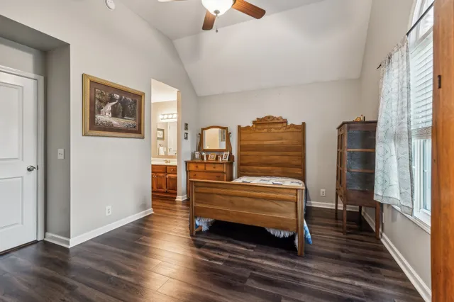 a view of room with furniture and wooden floor