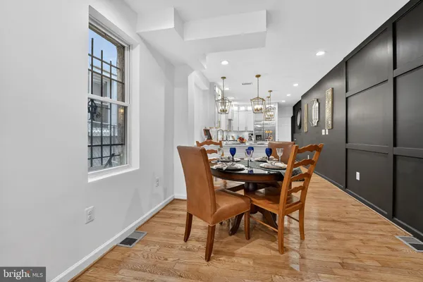 a view of a dining room with furniture and window