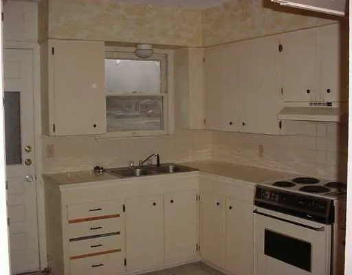a kitchen with a stove and a sink