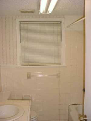 5861 Hampshire Road Corpus Christi, TX 78408 - Photo 6 of 7 a bathroom with a toilet and a shower