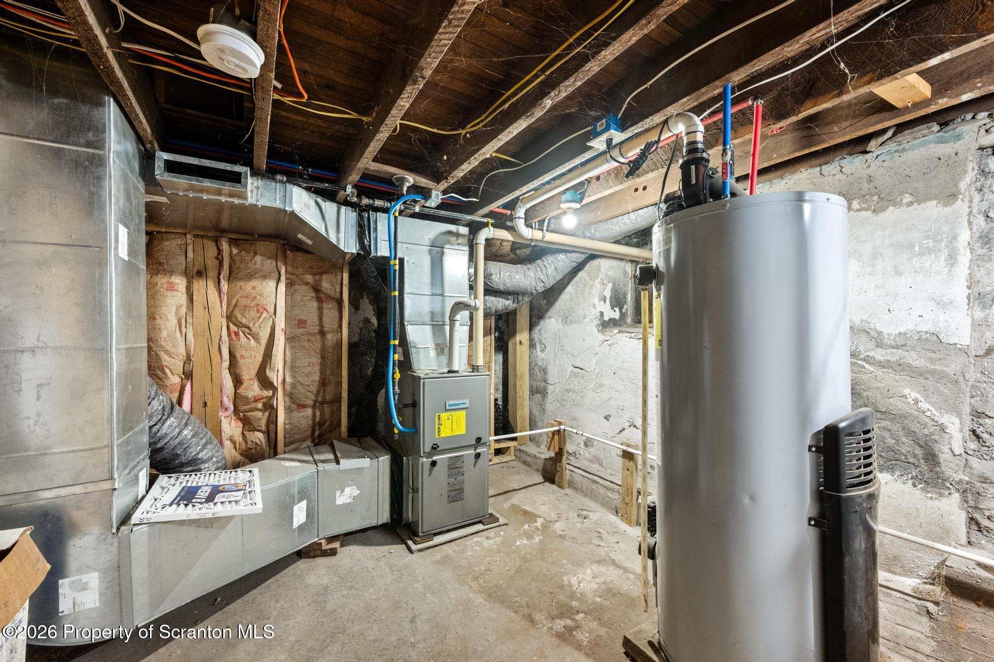 1227 Bennett Street Old Forge, PA 18518 - Photo 22 of 26 a view of walk in closet with clothes and shoes