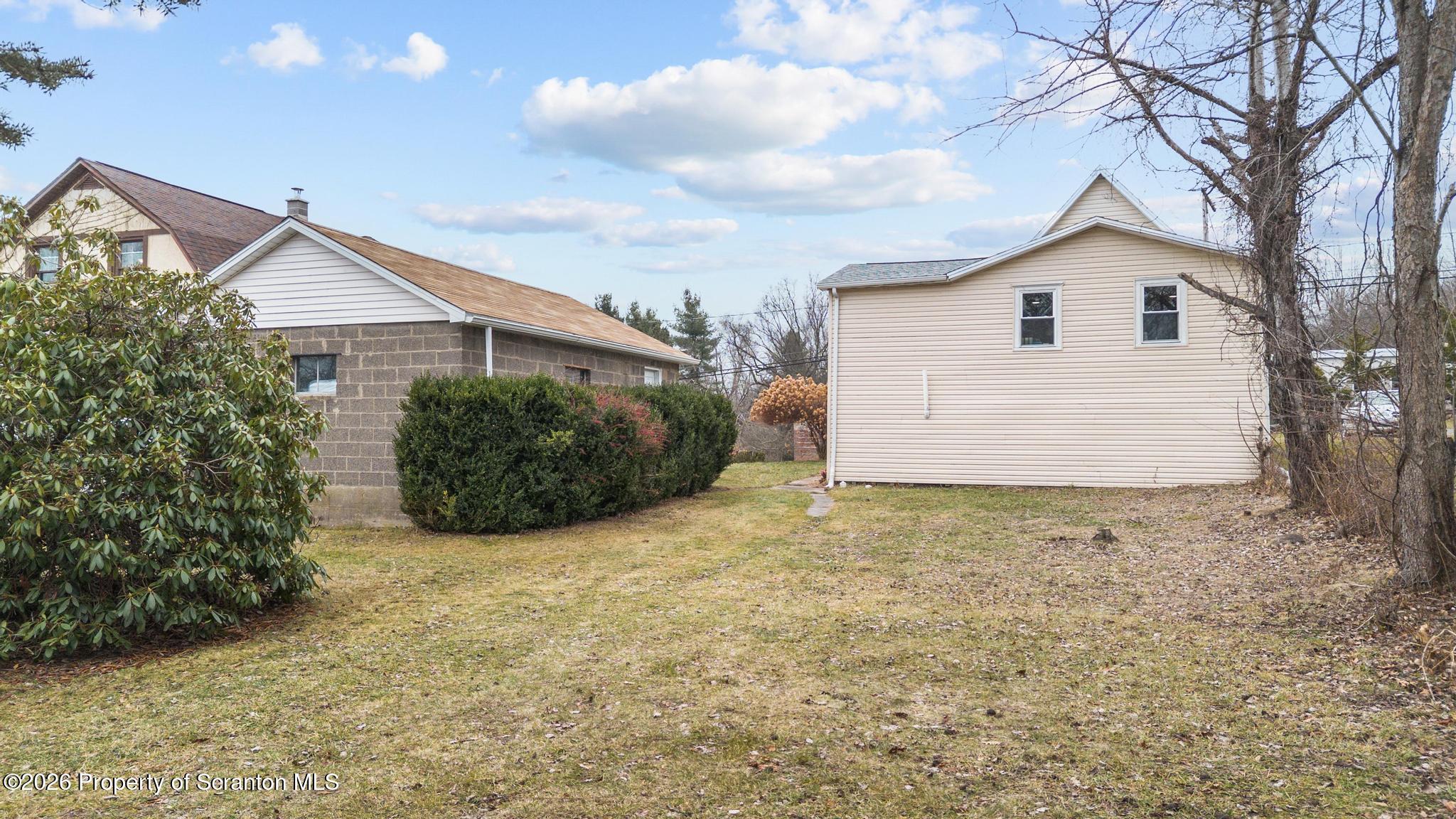 1227 Bennett Street Old Forge, PA 18518 - Photo 24 of 26 a view of backyard of house and garage