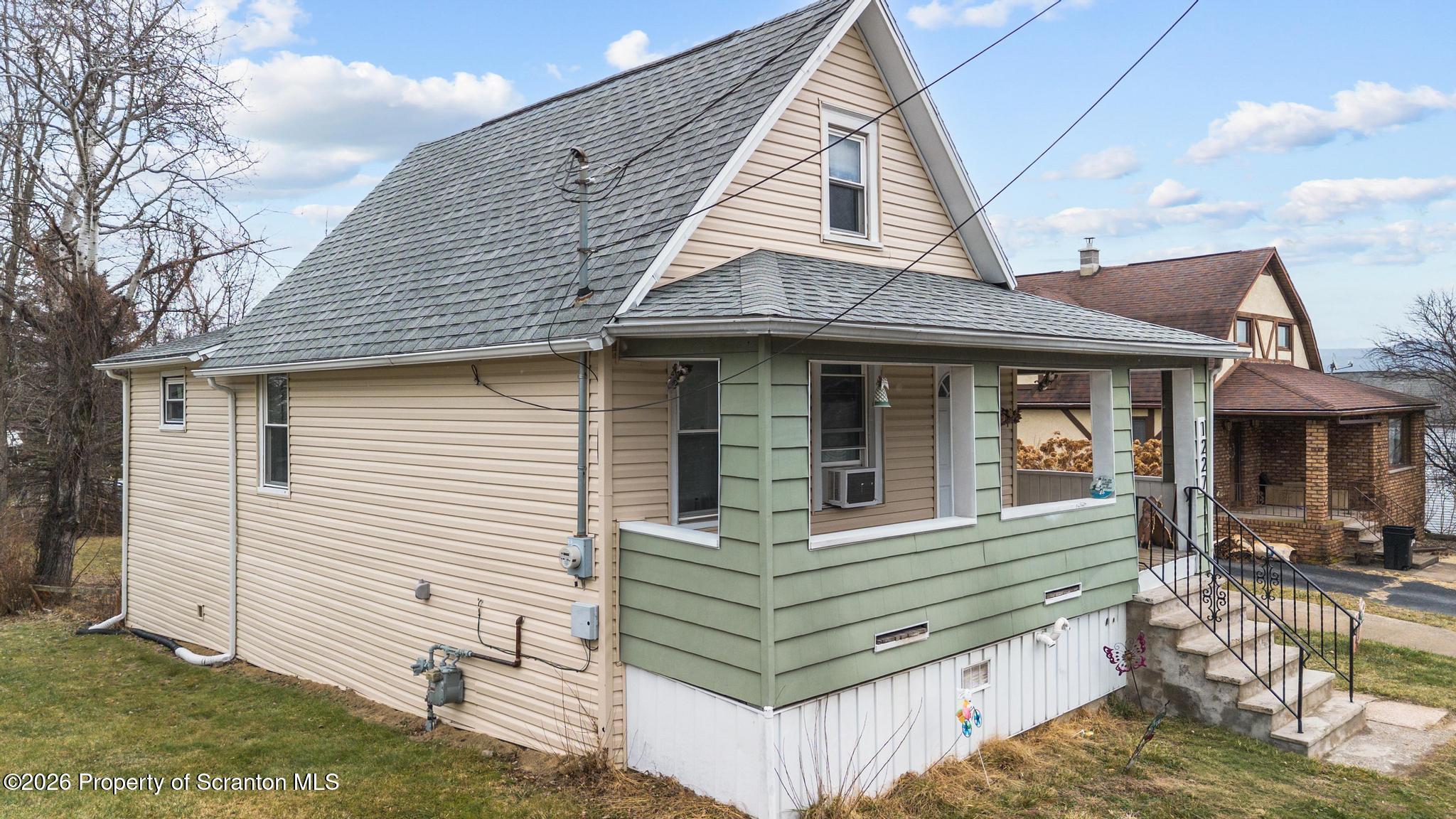 1227 Bennett Street Old Forge, PA 18518 - Photo 26 of 26 a view of a house with a yard and furniture