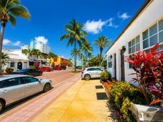 a view of a street with cars