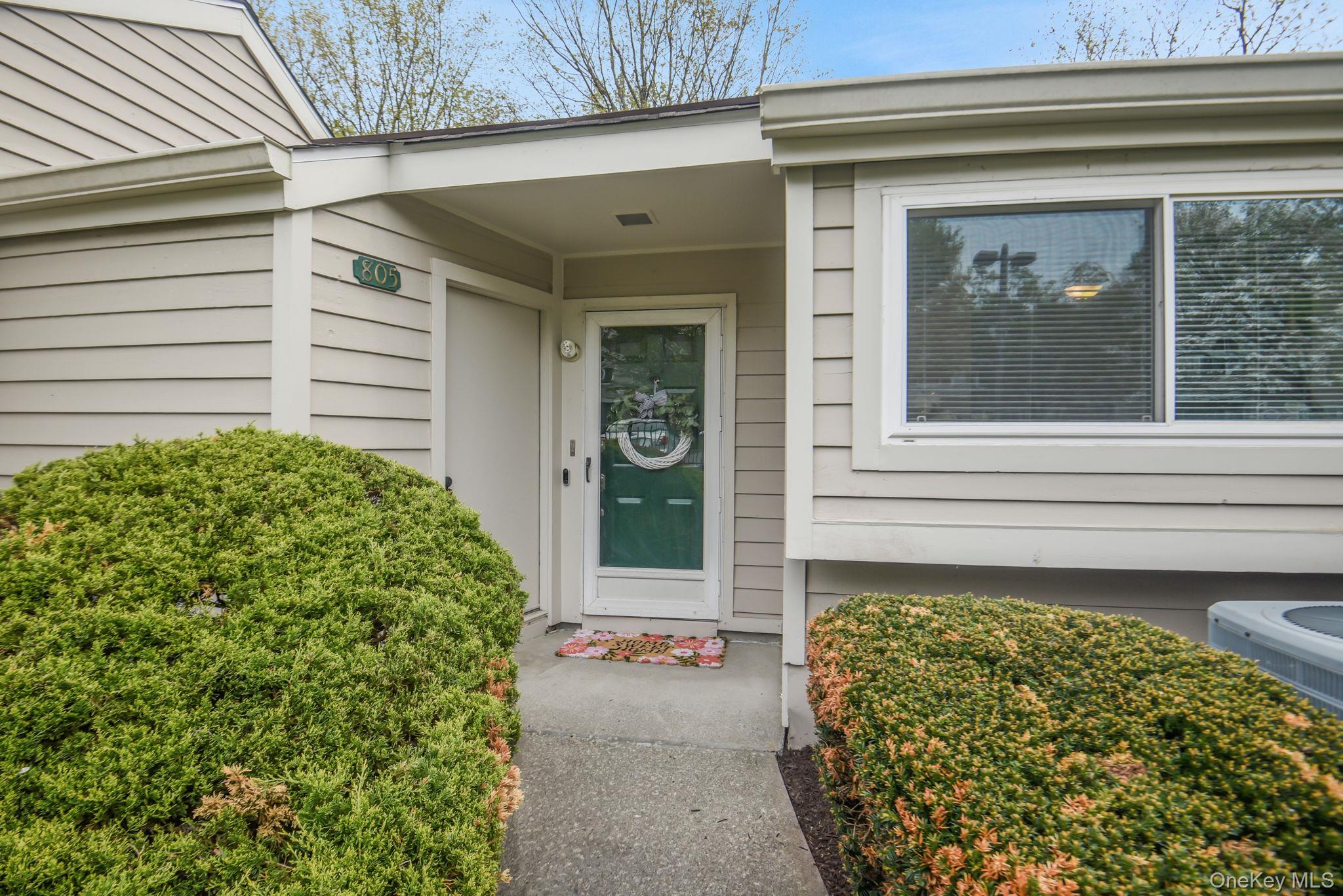 805 Eagles Ridge Road Brewster, NY 10509 - Photo 1 of 22 a front view of a house with garden