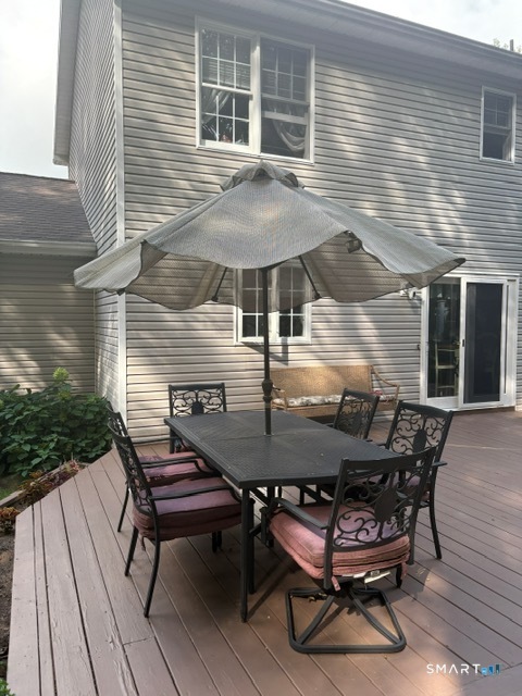 68 Doris Road Bristol, CT 06010 - Photo 15 of 31 a backyard of a house with table and chairs