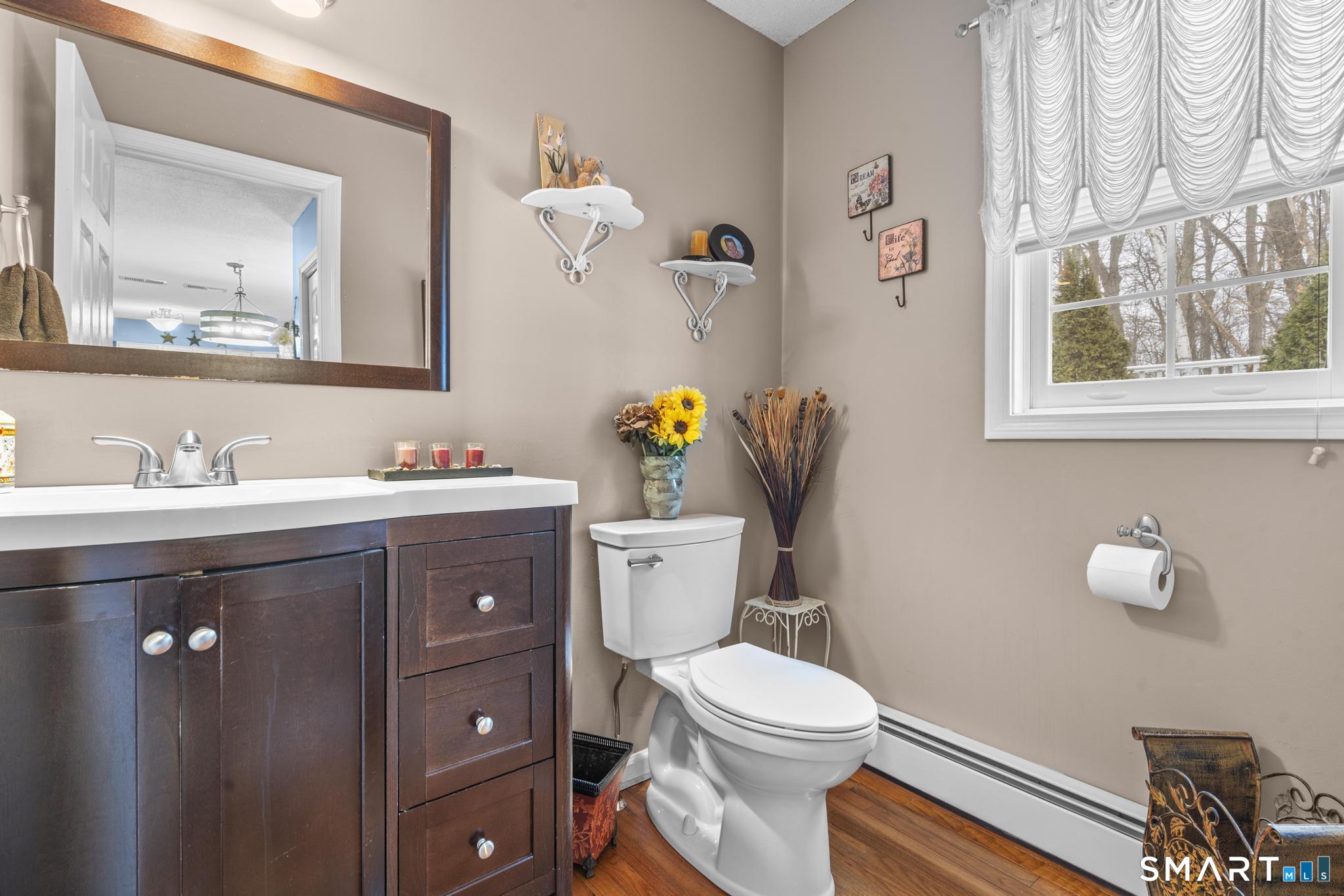 68 Doris Road Bristol, CT 06010 - Photo 18 of 31 a bathroom with a sink vanity mirror and toilet