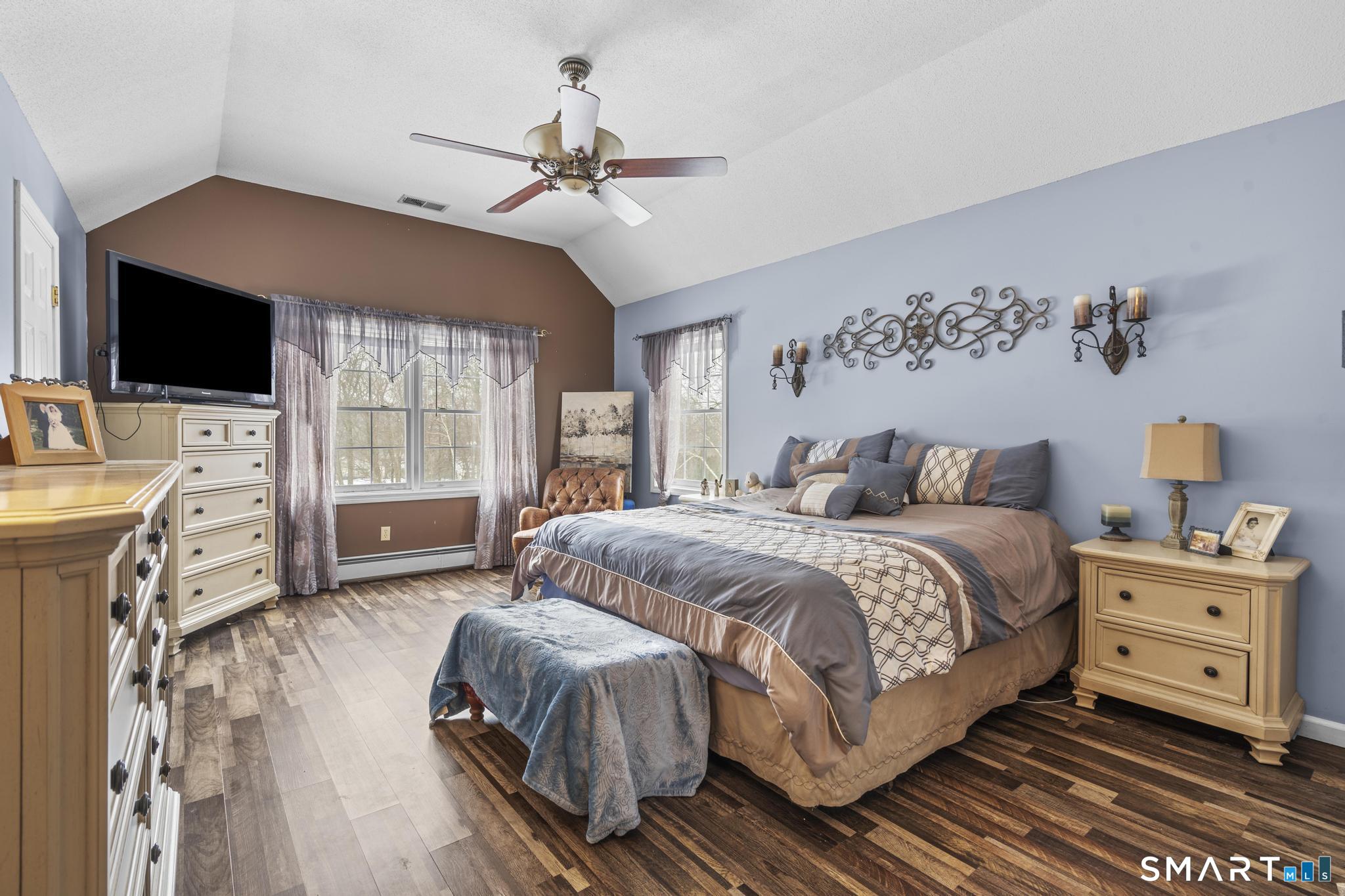 68 Doris Road Bristol, CT 06010 - Photo 19 of 31 a bedroom with a large bed and a flat tv screen on dresser