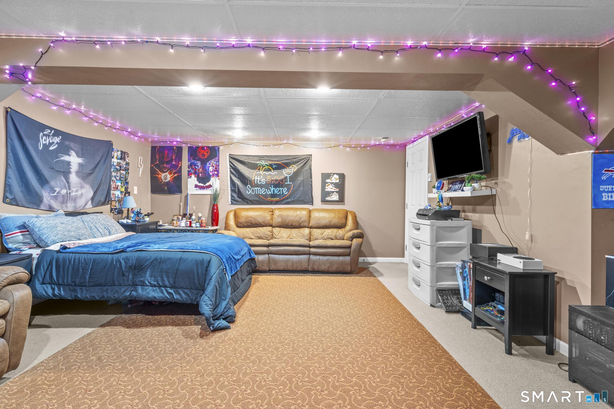 68 Doris Road Bristol, CT 06010 - Photo 26 of 31 a bedroom with furniture and a flat screen tv