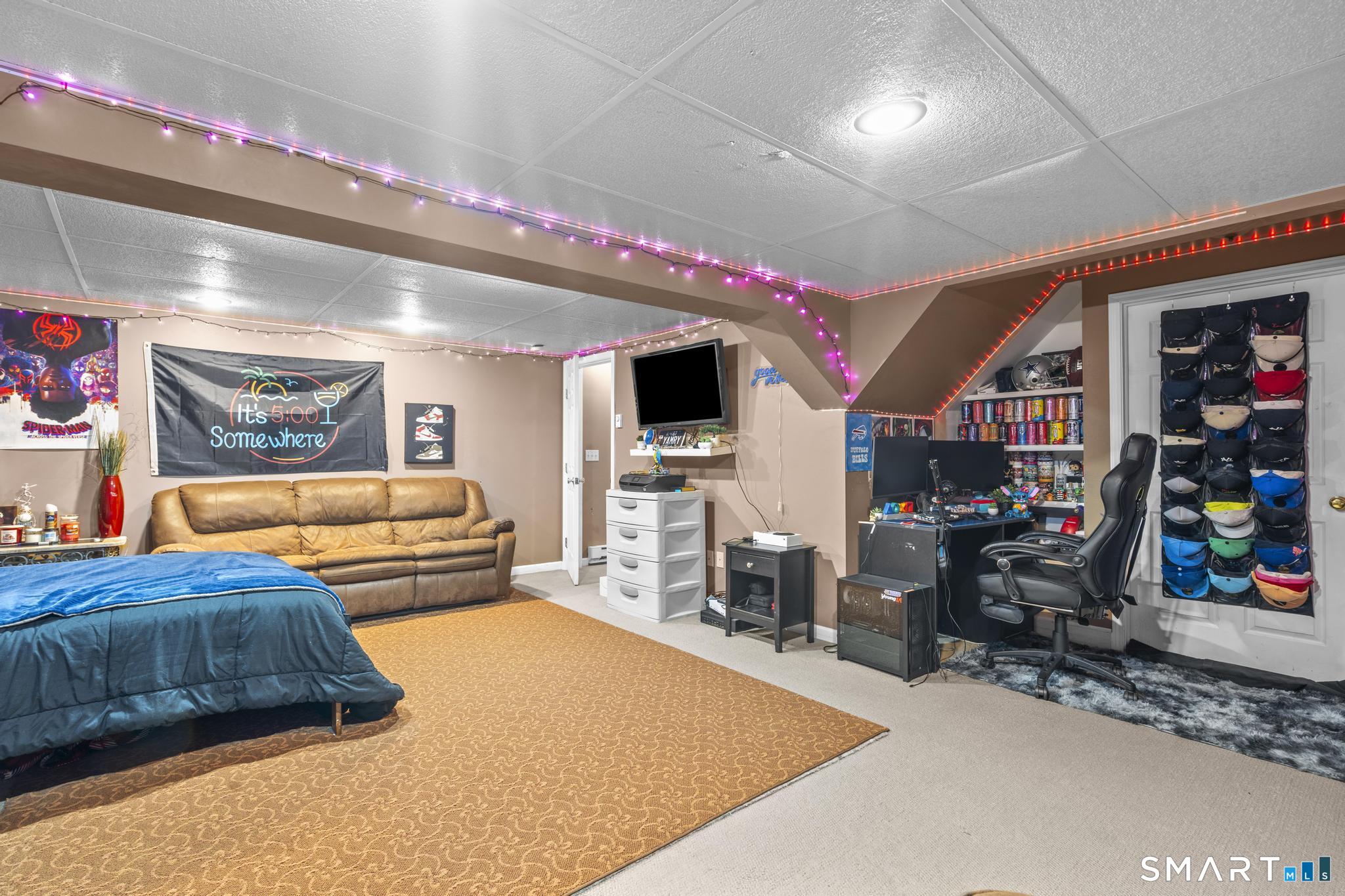 68 Doris Road Bristol, CT 06010 - Photo 27 of 31 a bedroom with furniture and a flat screen tv