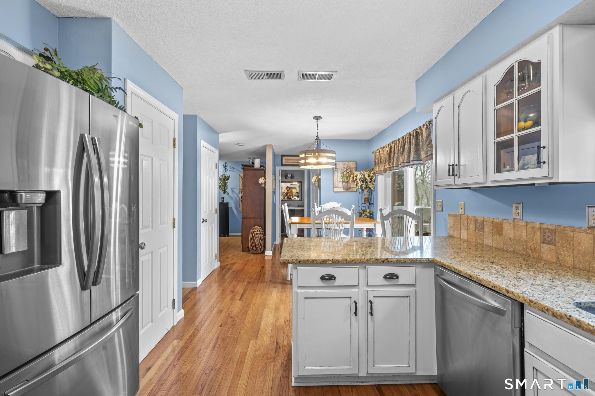 68 Doris Road Bristol, CT 06010 - Photo 5 of 31 a kitchen with stainless steel appliances granite countertop a refrigerator and a sink