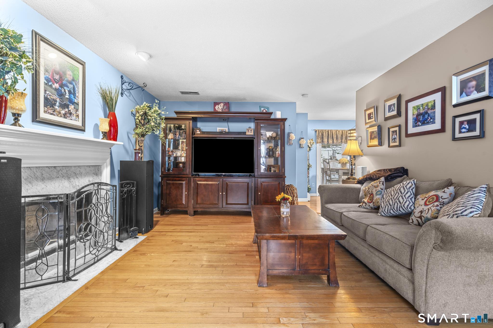 68 Doris Road Bristol, CT 06010 - Photo 7 of 31 a living room with furniture and a flat screen tv