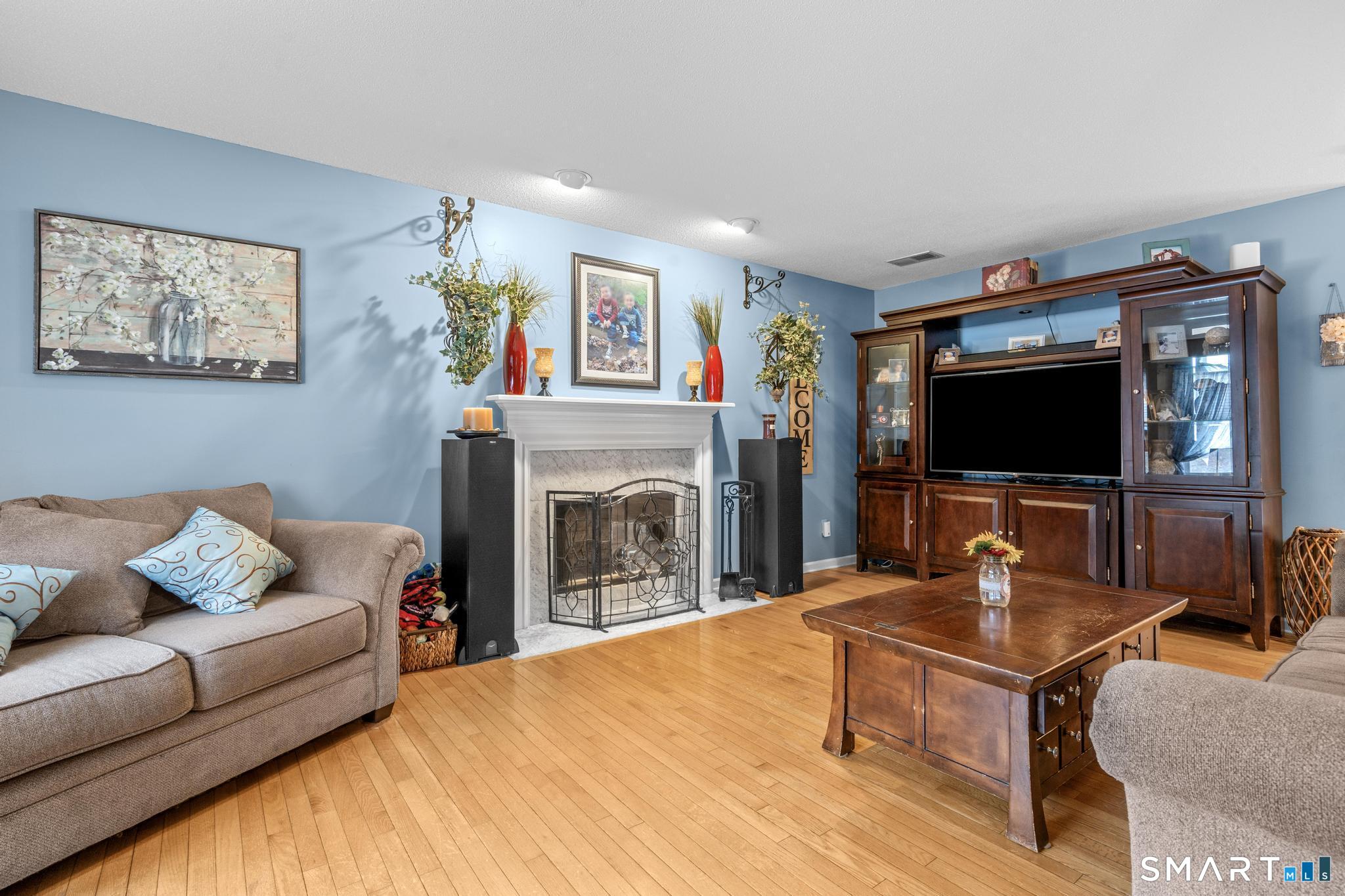 68 Doris Road Bristol, CT 06010 - Photo 8 of 31 a living room with furniture and a flat screen tv