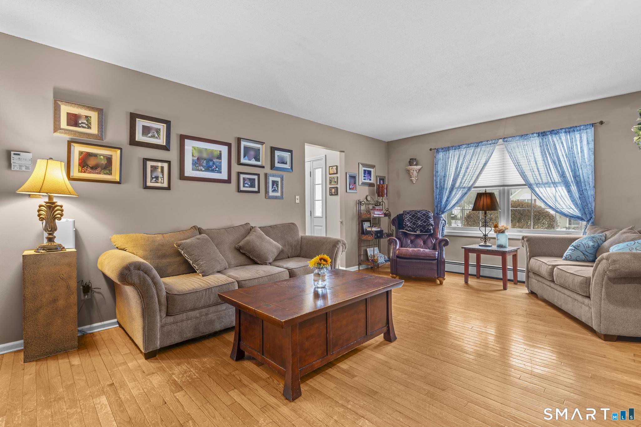 68 Doris Road Bristol, CT 06010 - Photo 9 of 31 a living room with furniture and a large window