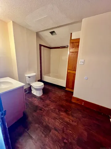 a living room with a table and a couch