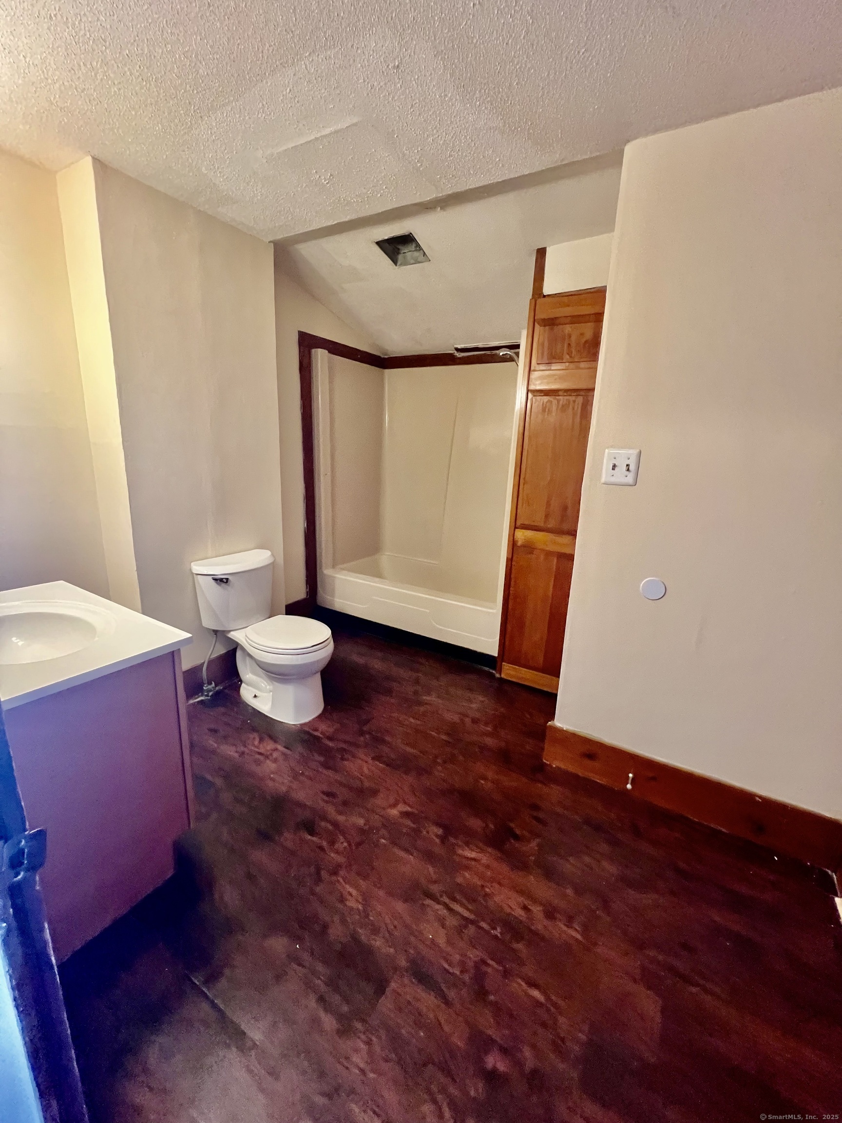 10 Russell Street Enfield, CT 06082 - Photo 11 of 12 a living room with a table and a couch