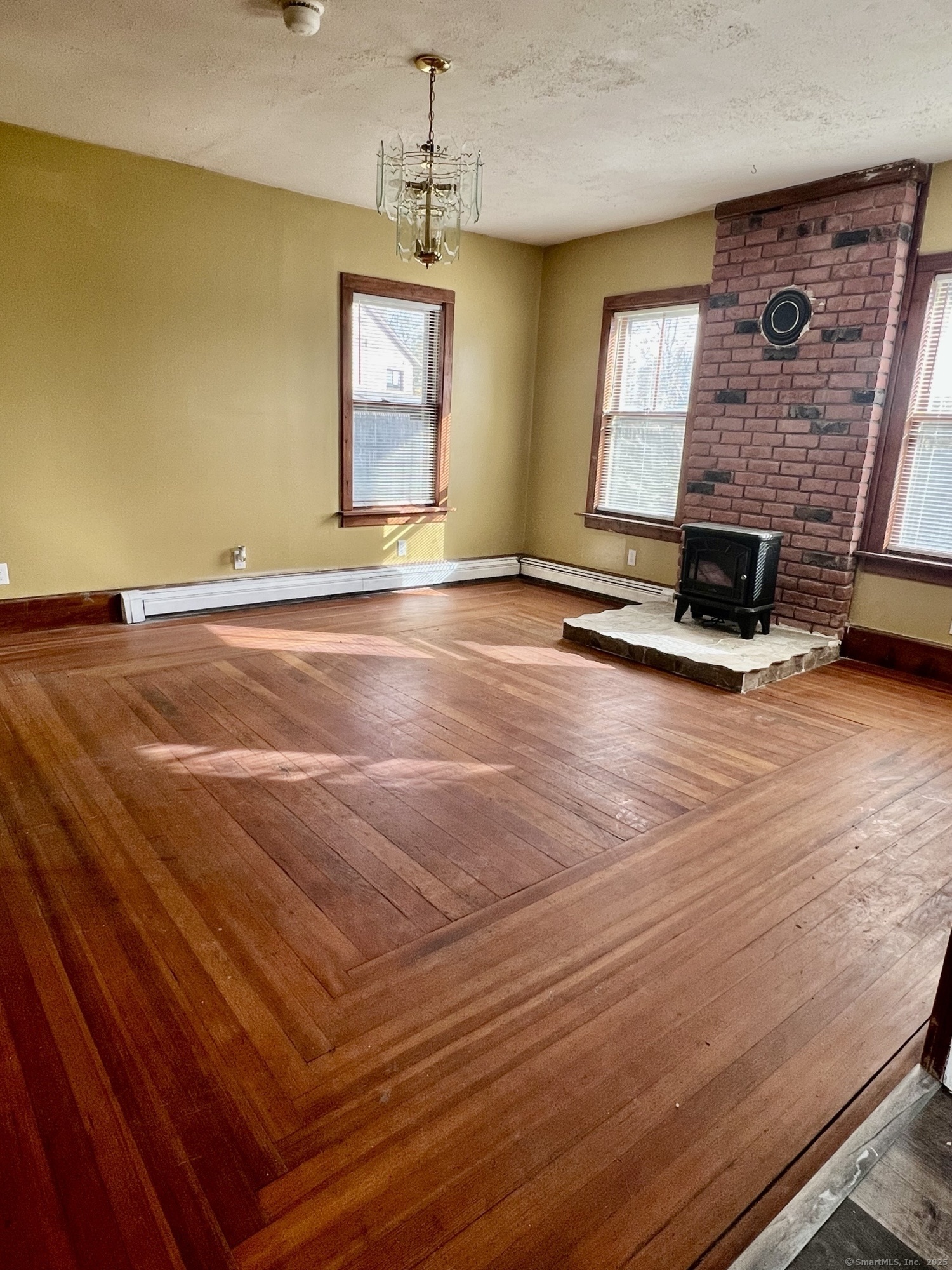 10 Russell Street Enfield, CT 06082 - Photo 3 of 12 a view of a livingroom with a fireplace and window