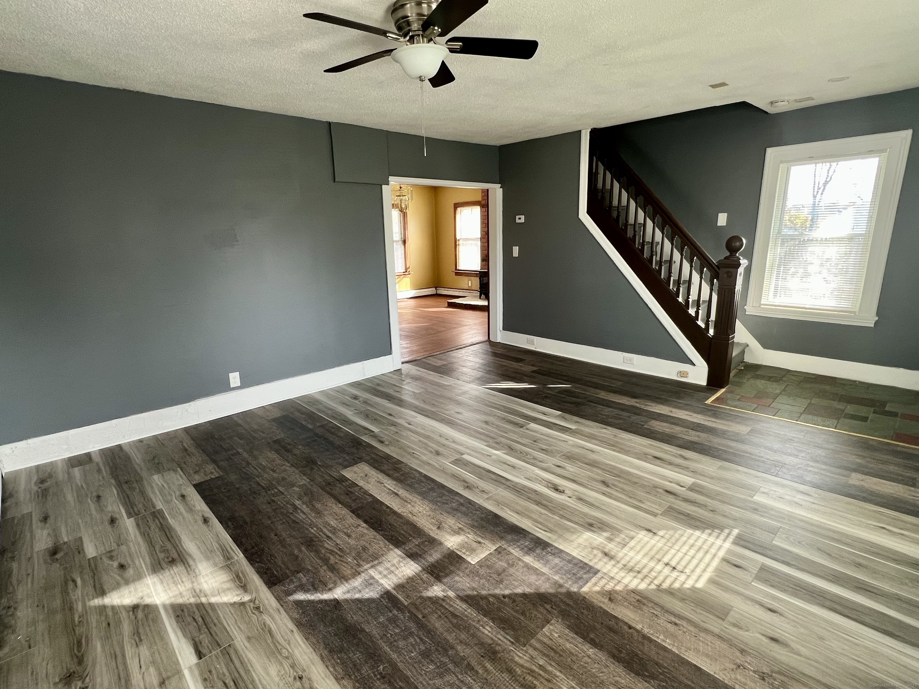 10 Russell Street Enfield, CT 06082 - Photo 6 of 12 a view of an empty room with wooden floor and a window