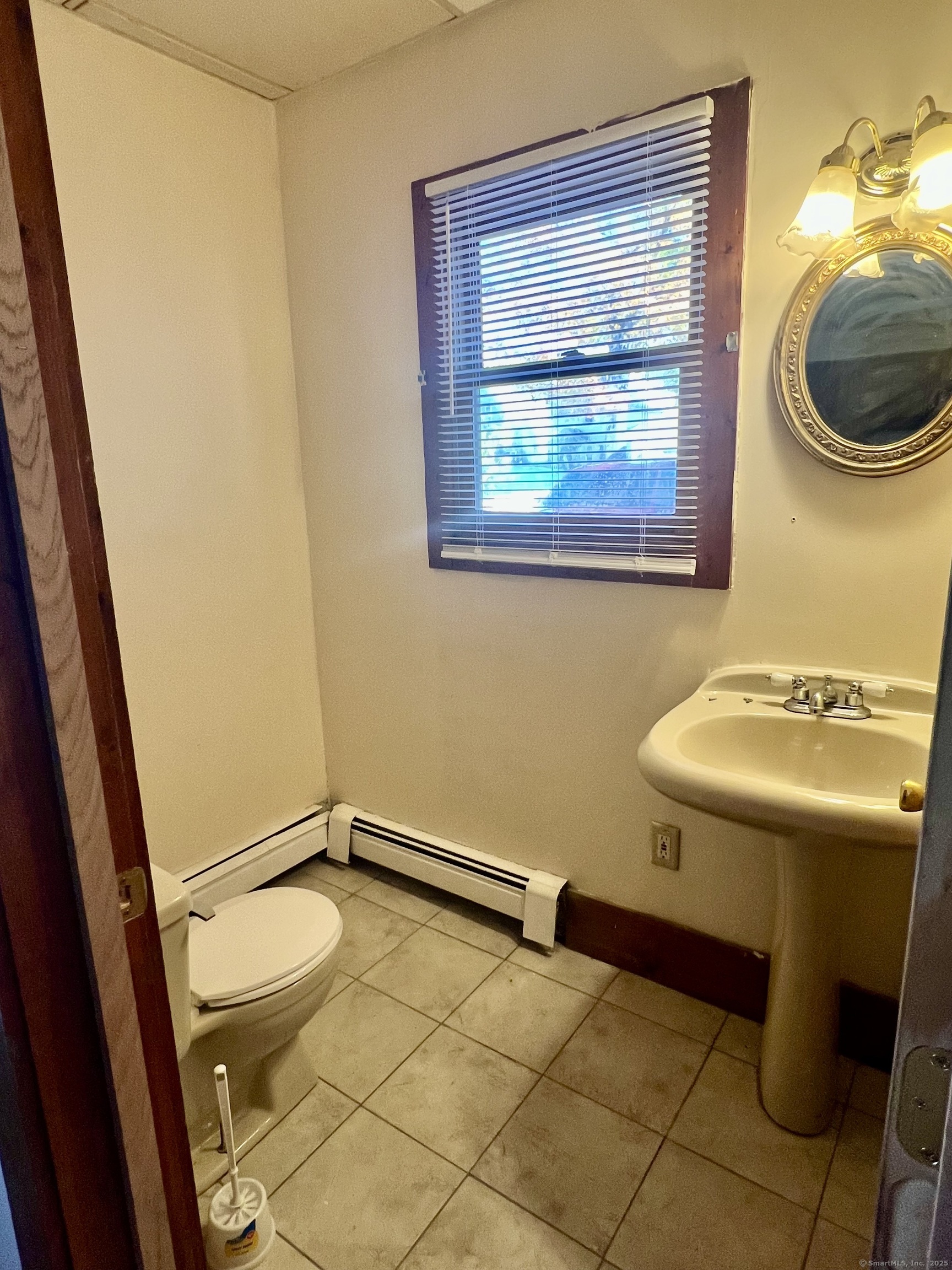 10 Russell Street Enfield, CT 06082 - Photo 10 of 12 a bathroom with a sink and mirror