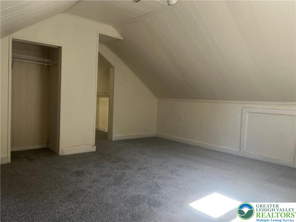 1839 Willow Park Road Bethlehem, PA 18020 - Photo 22 of 35 Sloped ceilings and a carpeted floor create a cozy and functional attic space.