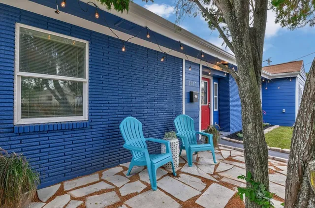 a view of a two chairs in the balcony
