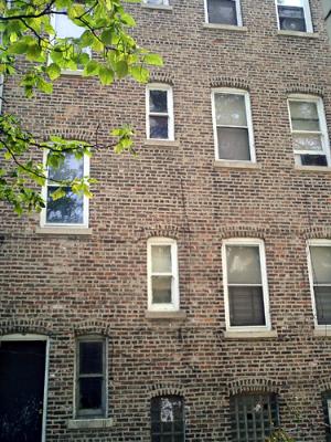 352 South Hamlin Boulevard Chicago, IL 60624 - Photo 2 of 12 a brick building with a door