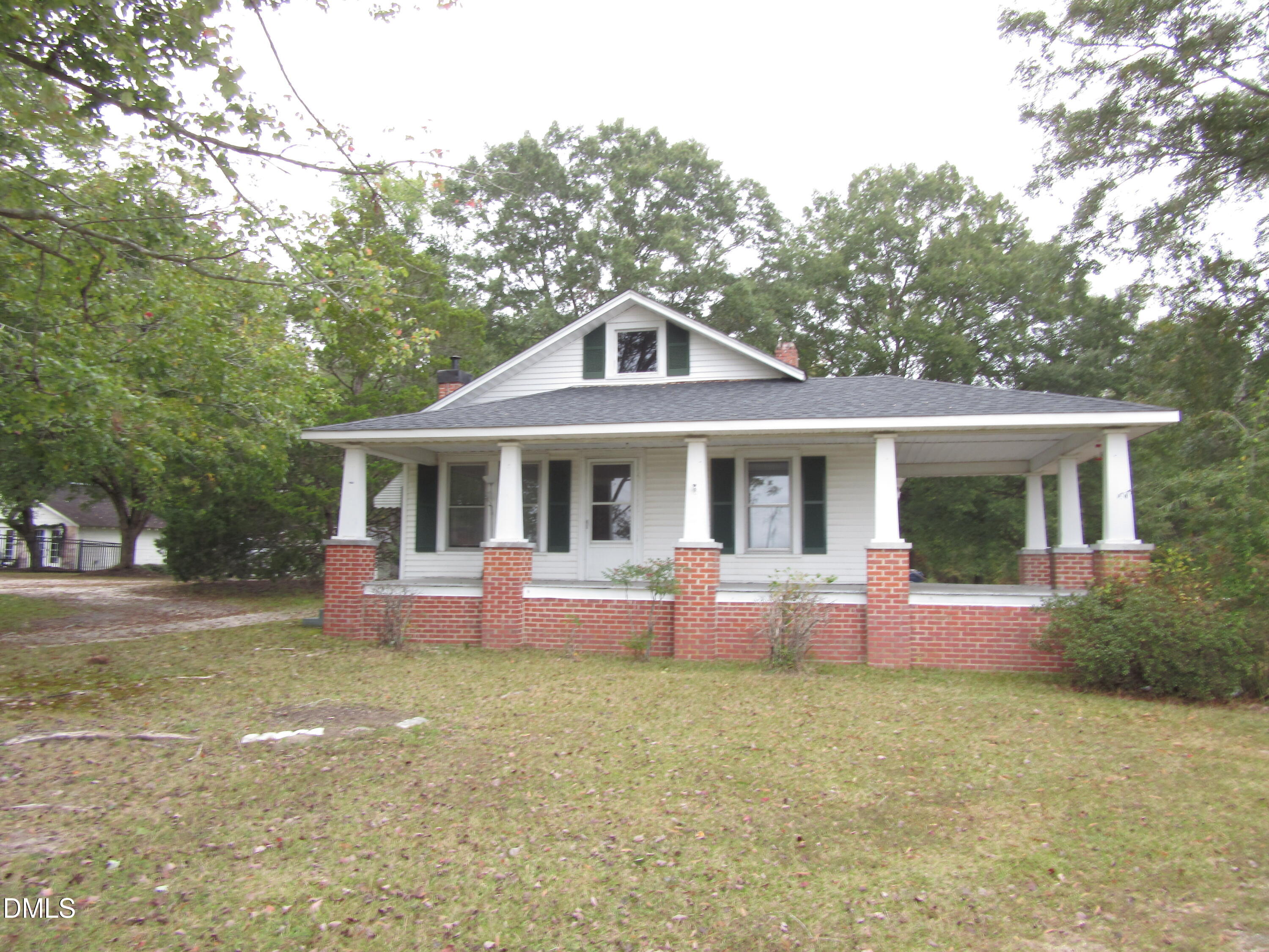 a front view of house with outdoor seating