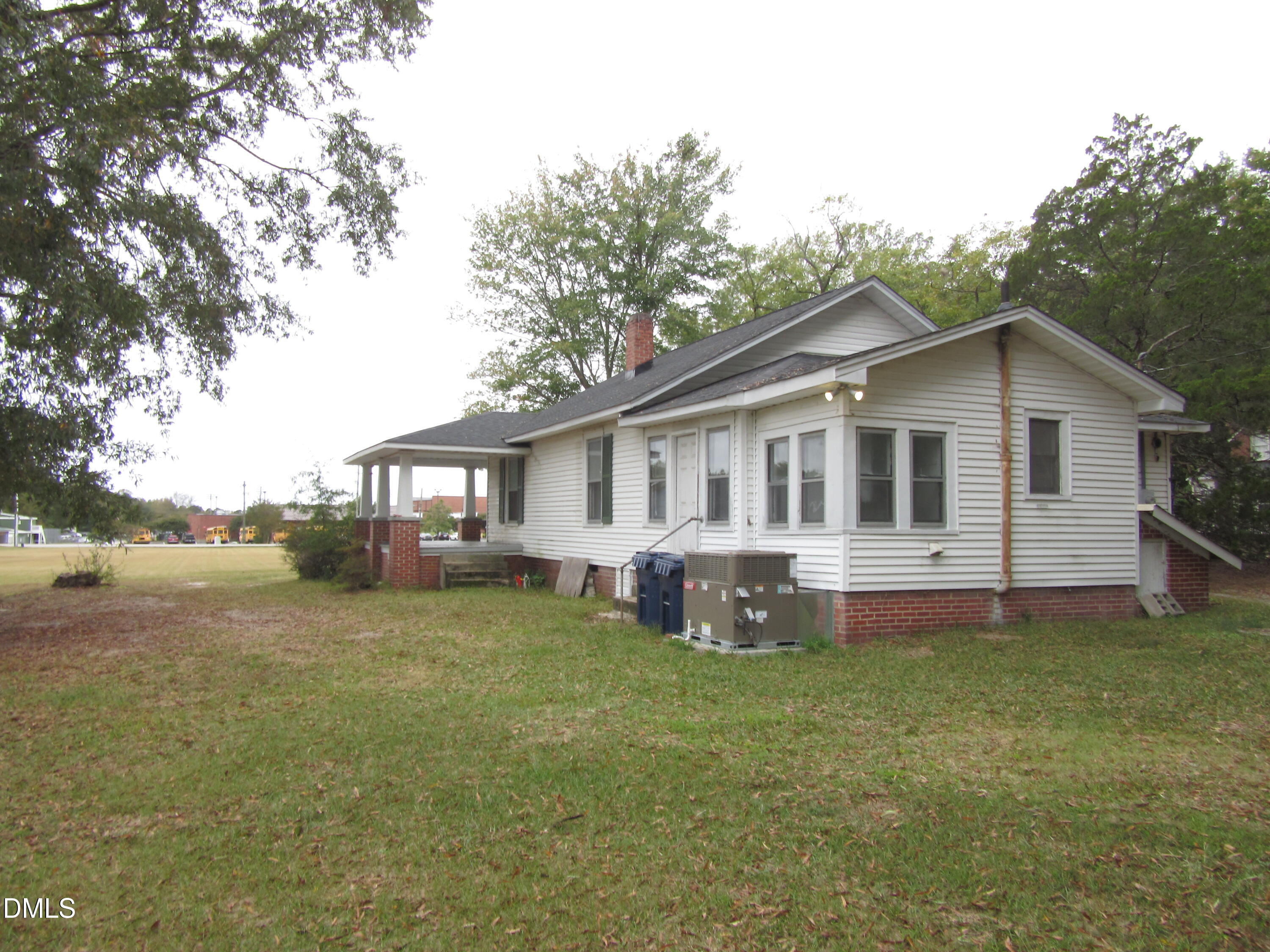 545 Main Street Bunn, NC 27508 - Photo 11 of 13 a view of a house with a yard and sitting area