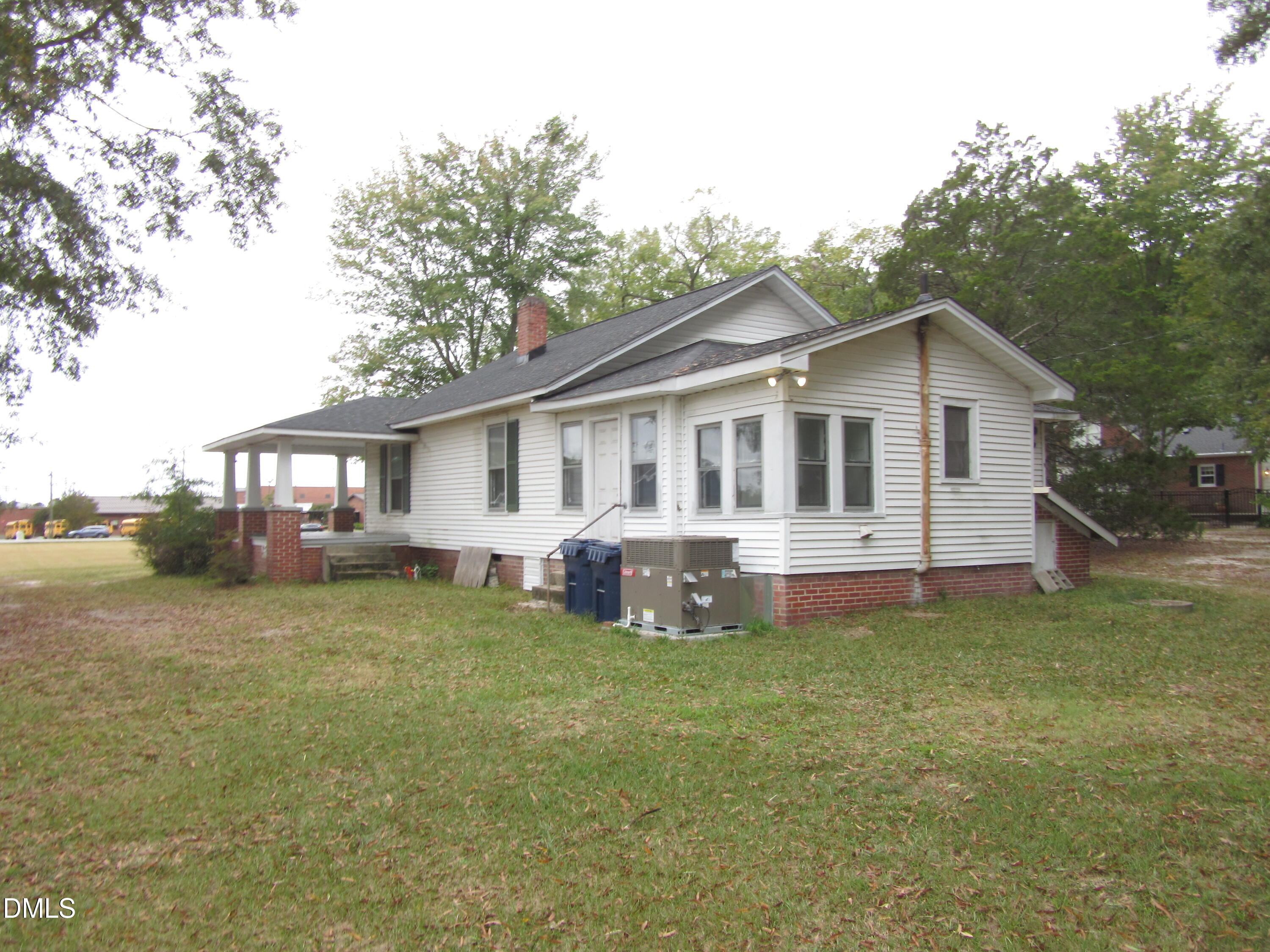 545 Main Street Bunn, NC 27508 - Photo 13 of 13 a view of a house with a yard and sitting area