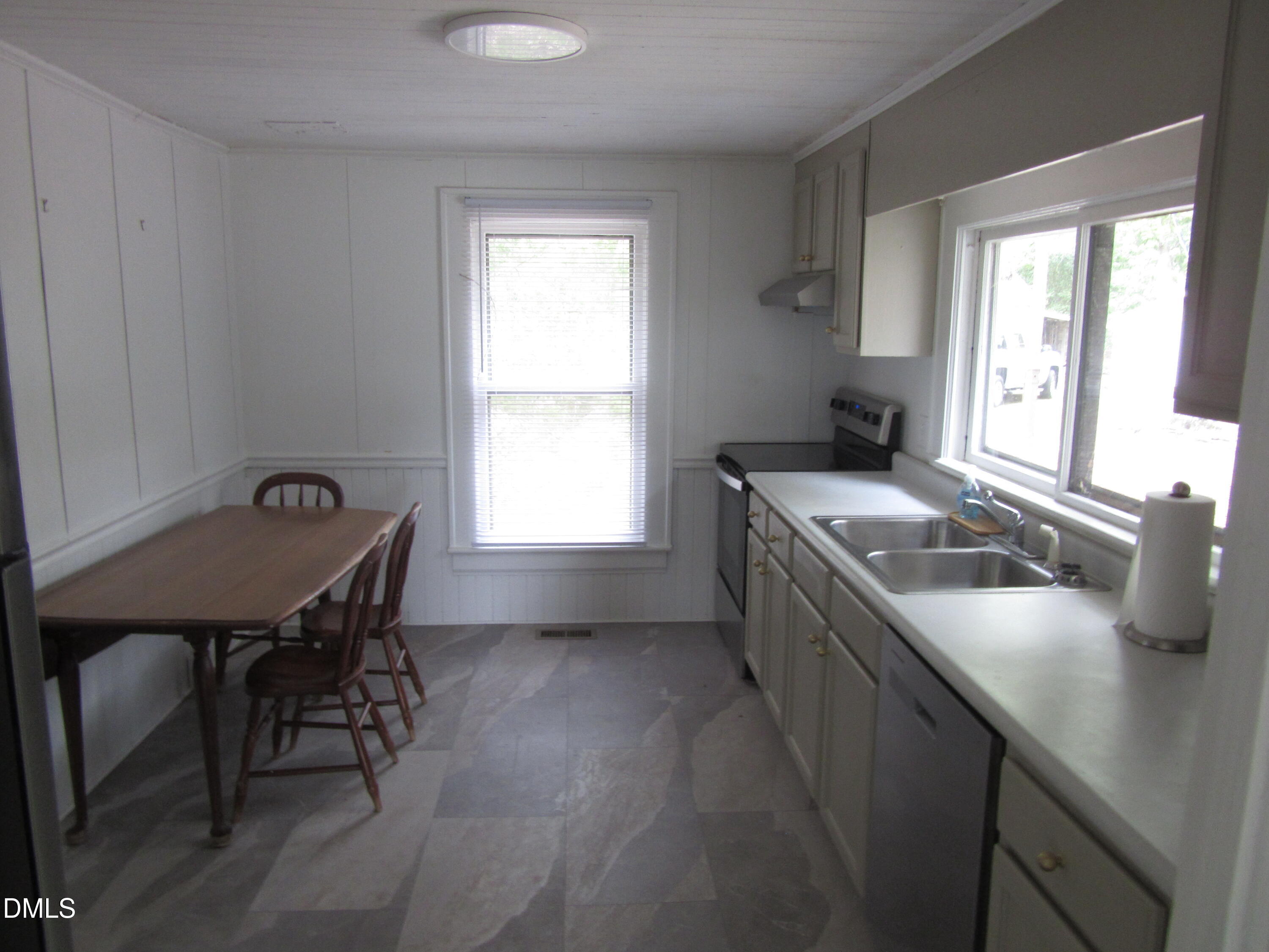 545 Main Street Bunn, NC 27508 - Photo 7 of 13 a kitchen that has a sink a chair in it