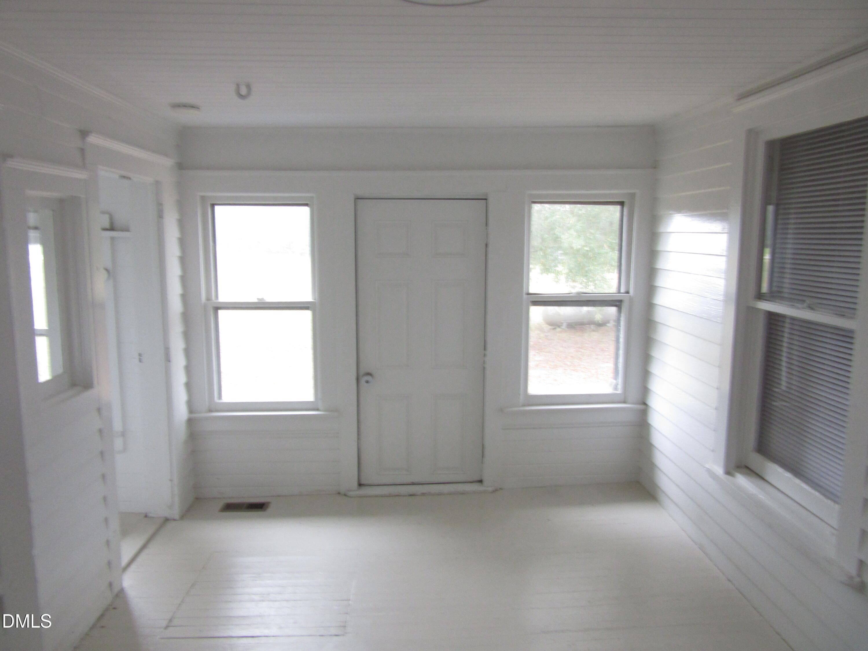 545 Main Street Bunn, NC 27508 - Photo 8 of 13 an empty room with windows