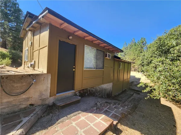 a view of a livingroom with an empty space and a window