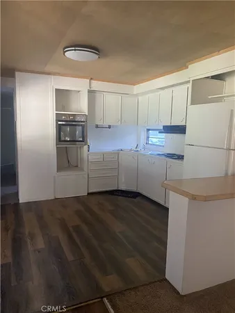 a view of a kitchen with a sink