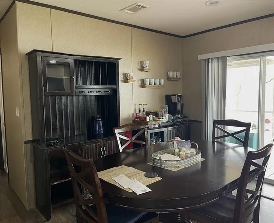 a view of a dining room with furniture