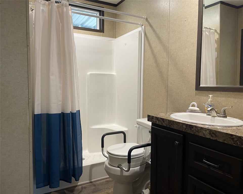 351 Club Lake Road Teague, TX 75860 - Photo 20 of 34 a bathroom with a sink and a mirror