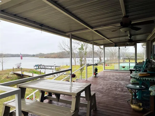 a view of swimming pool with seating area and furniture