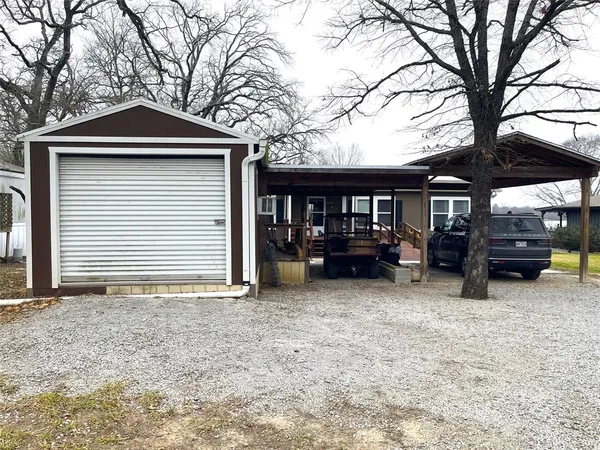 a front view of a house with outdoor seating