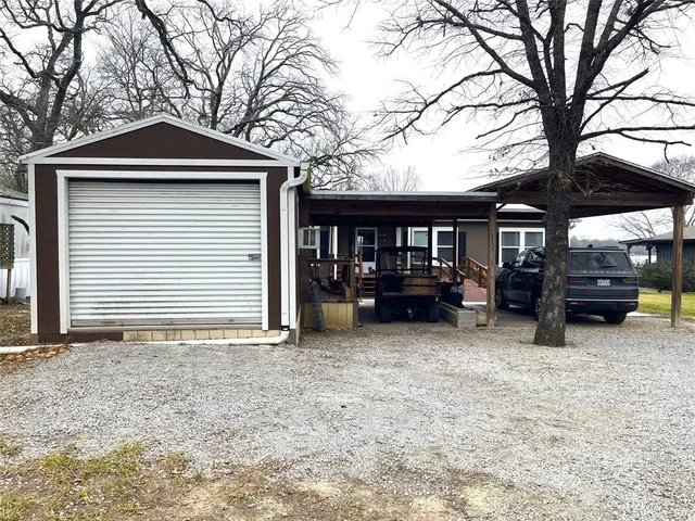 a front view of a house with outdoor seating