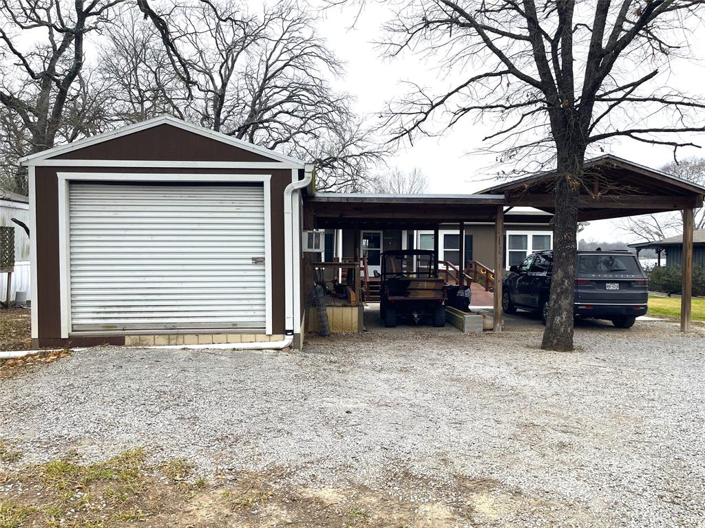 351 Club Lake Road Teague, TX 75860 - Photo 31 of 34 a view of a house with a yard