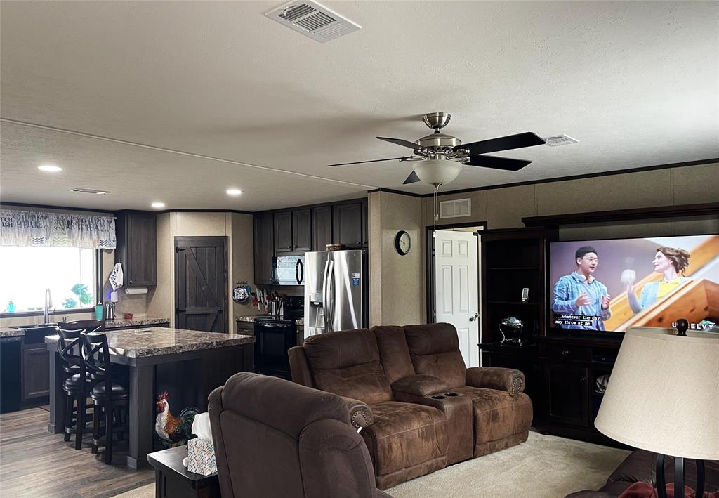 351 Club Lake Road Teague, TX 75860 - Photo 7 of 34 a living room with furniture and a flat screen tv