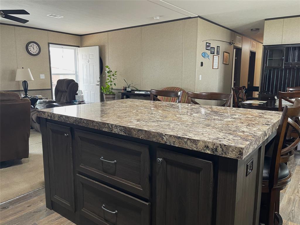 351 Club Lake Road Teague, TX 75860 - Photo 9 of 34 a bathroom with a granite countertop sink a mirror and shower