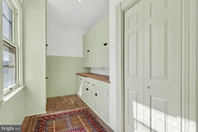 a bathroom with a double vanity sink and mirror