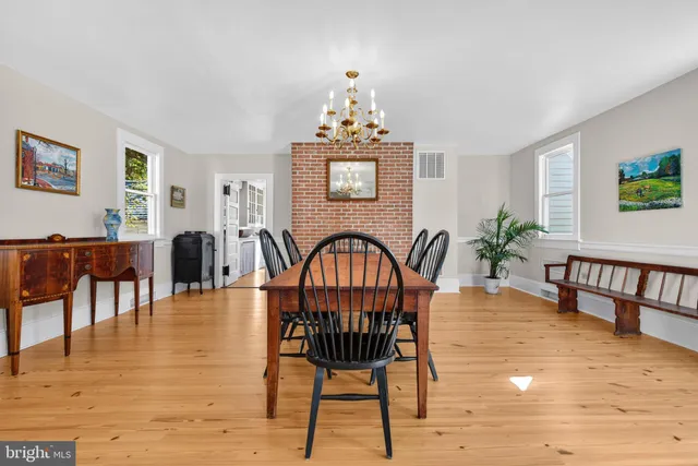 a view of a livingroom with furniture window and wooden floor
