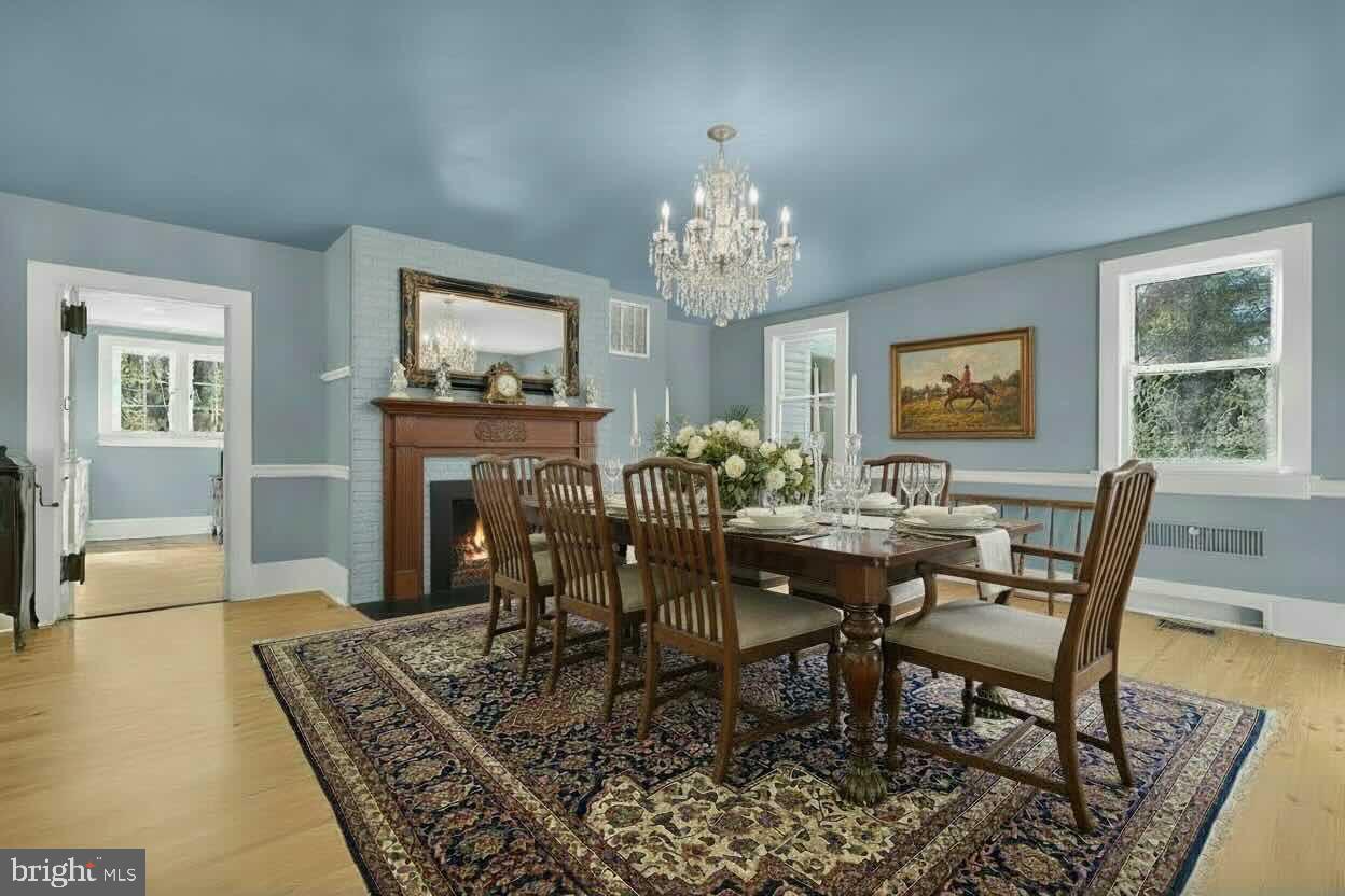 4559 Weston Road Catlett, VA 20119 - Photo 18 of 57 a view of a dining room with furniture a rug and wooden floor