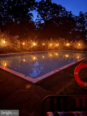 an aerial view of a house with swimming pool