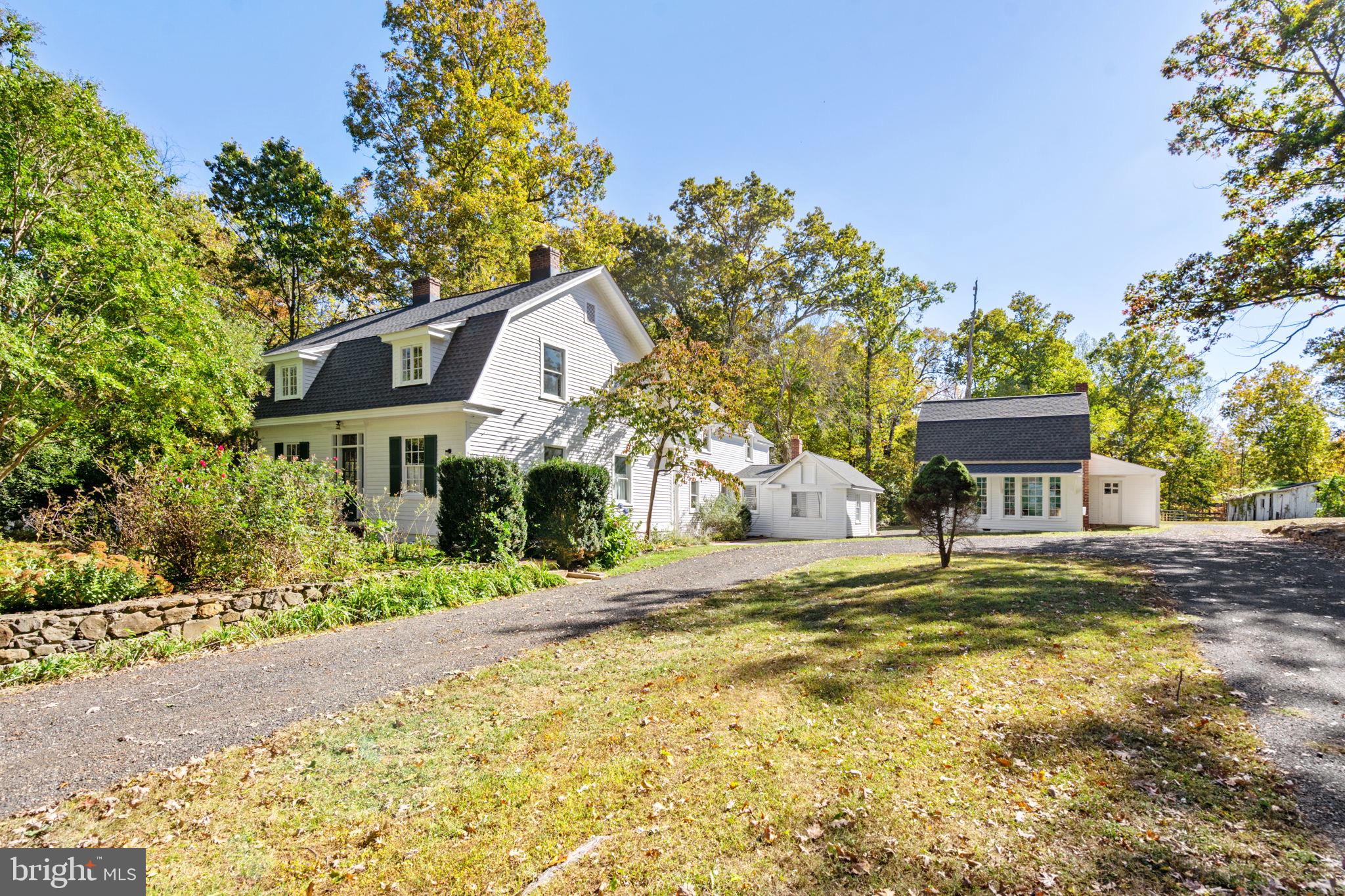 4559 Weston Road Catlett, VA 20119 - Photo 5 of 57 a front view of a house with a garden