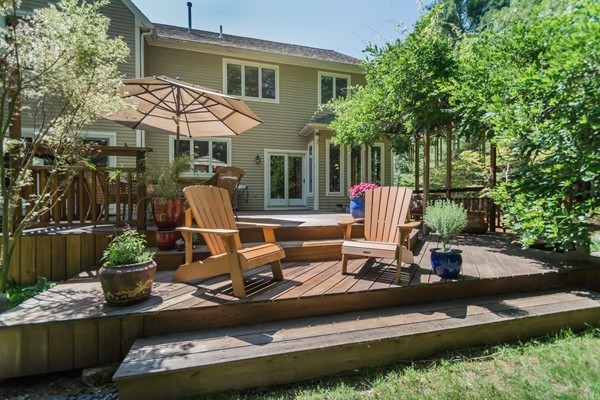 73 Ballardvale Road Andover, MA 01810 - Photo 24 of 26 a view of a house with backyard water fountain and sitting area