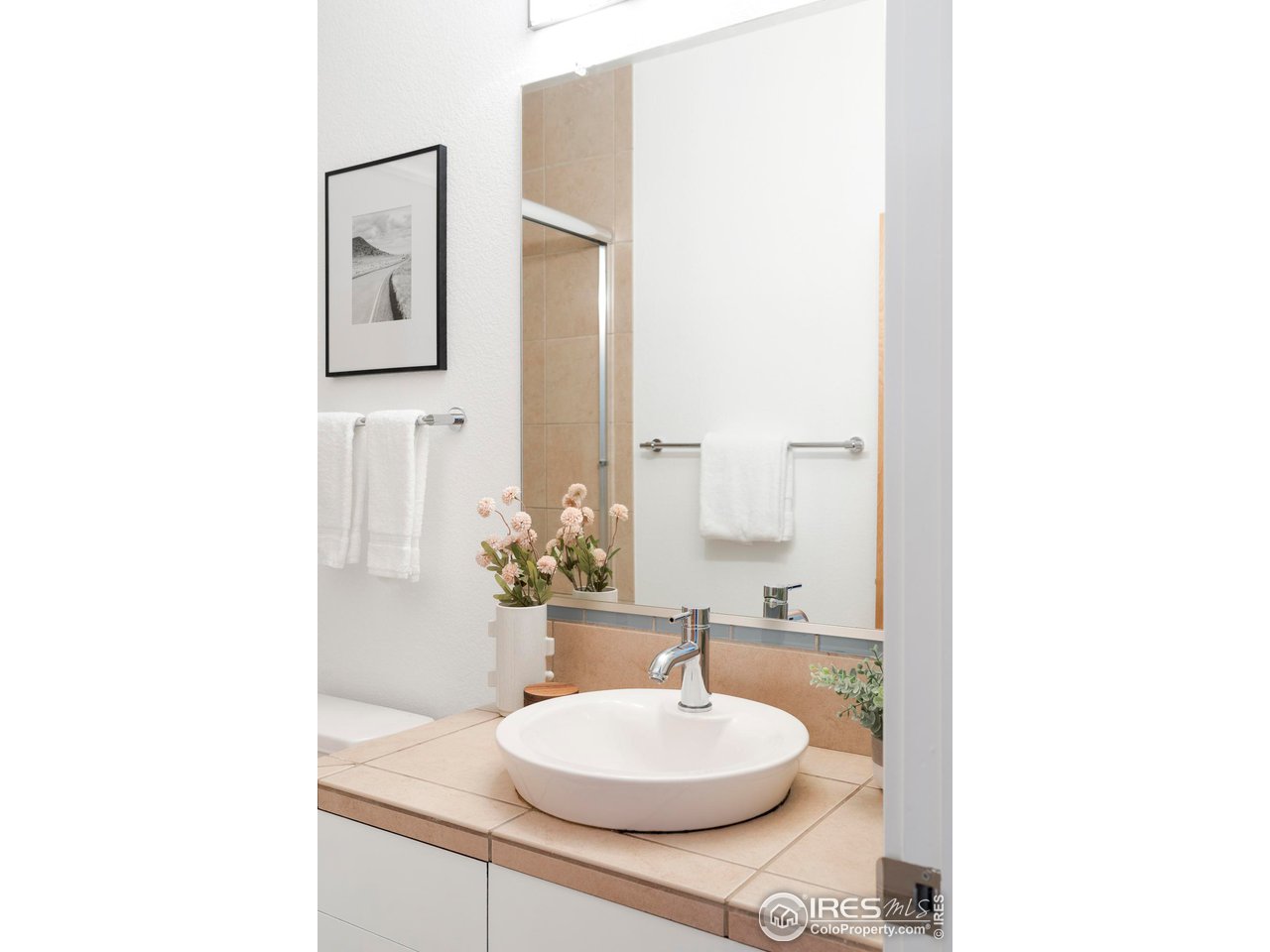 5247 5th Street Boulder, CO 80304 - Photo 20 of 34 a bathroom with a sink and a mirror