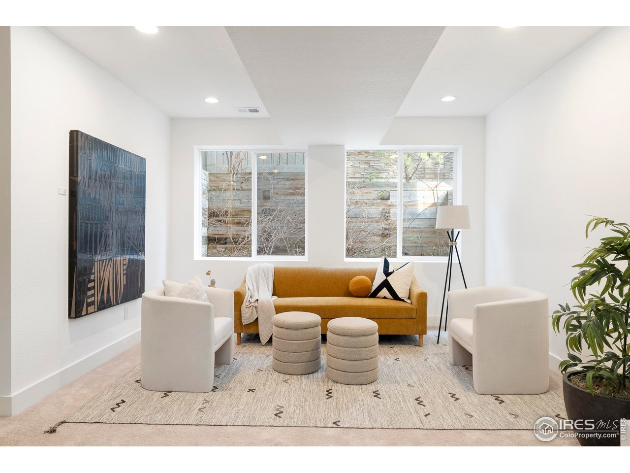 5247 5th Street Boulder, CO 80304 - Photo 23 of 34 a living room with furniture and a large window