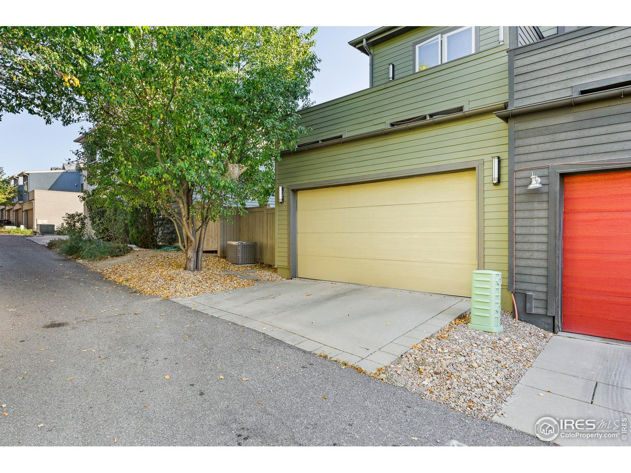 5247 5th Street Boulder, CO 80304 - Photo 31 of 34 a front view of a house with a yard and garage